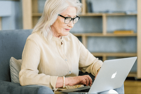 Employee-looking-at-digital-transformation-services-on-her-laptop.